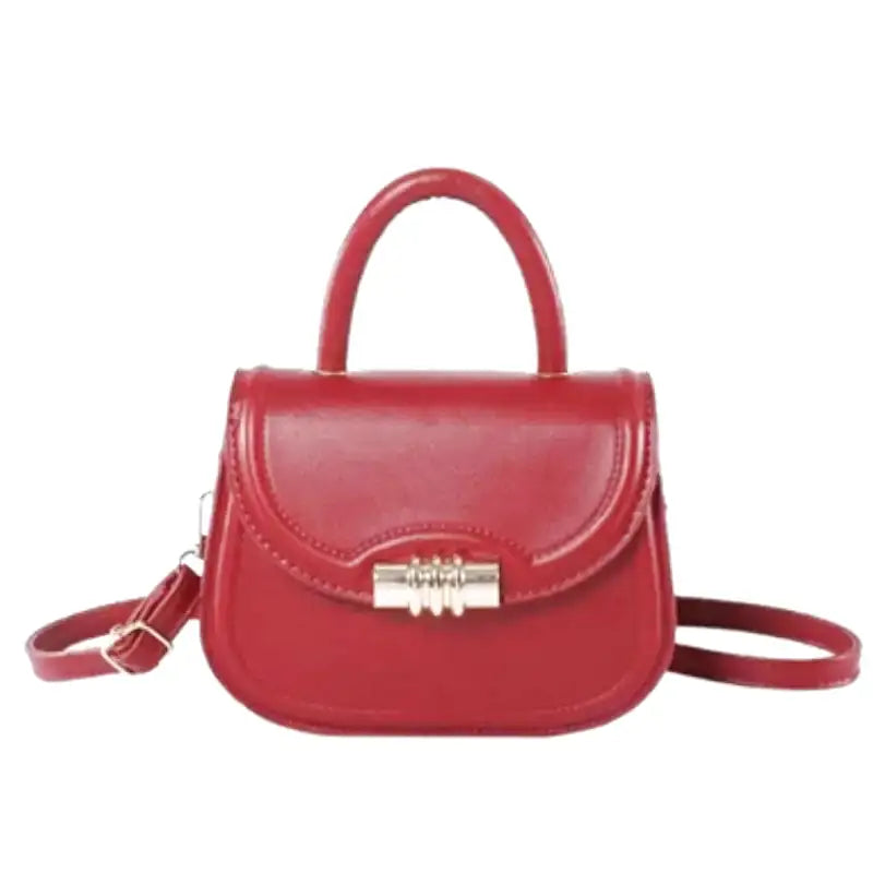 Petit sac à main rigide ELISA en bandoulière rouge, design compact et élégant, idéal pour transporter téléphone, porte-cartes et clés avec style