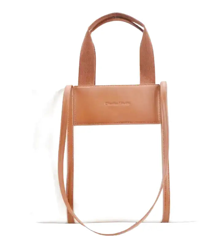 ac à main IVY en toile résistante blanche, bandoulière ajustable, cabas spacieux avec compartiments pour organiser vos essentiels avec style et confort, anses marron.