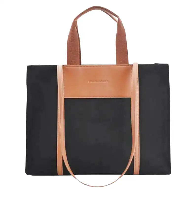 Sac à main IVY en toile résistante noire, bandoulière ajustable, cabas spacieux avec compartiments pour organiser vos essentiels avec style et confort, anses marron.