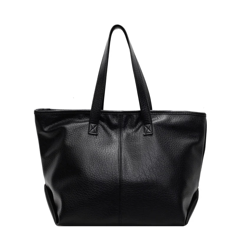 Sac à main KIM en cuir noir,  moderne et pratique, grand sac tote bag avec intérieur spacieux et finitions soignées, parfait pour le quotidien et le travail.