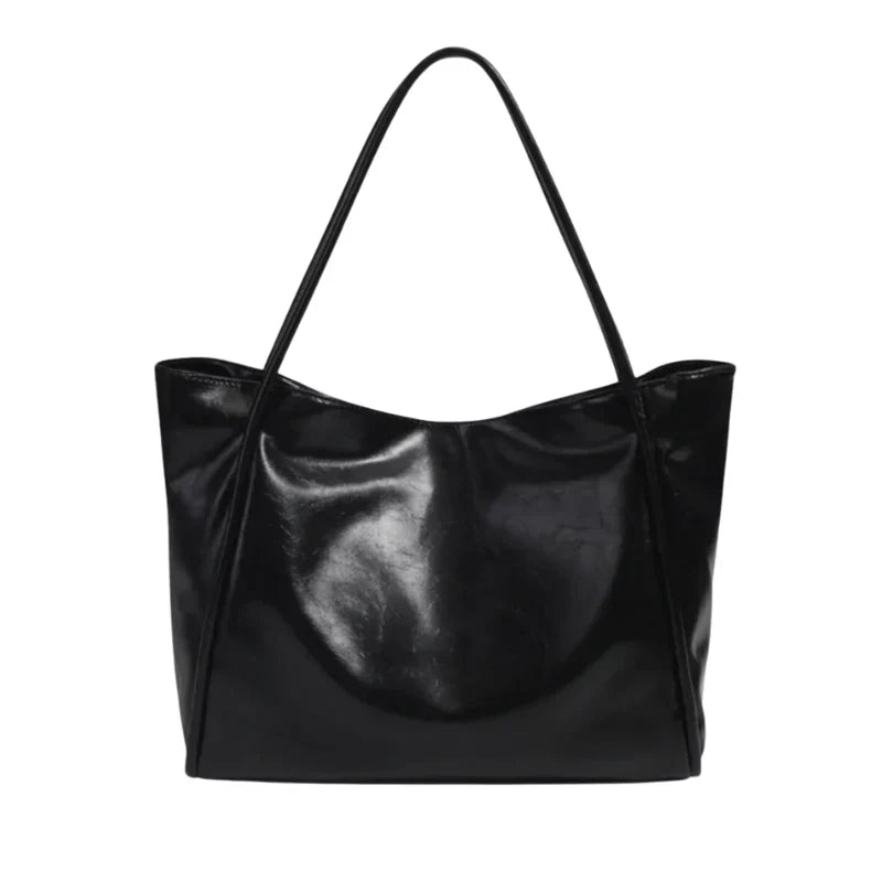 Sac à main LORIA en cuir NOIR, moderne et chic, avec bandoulière ajustable, intérieur spacieux et compartiments organisés, parfait pour le quotidien et les sorties.