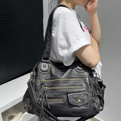Sac à main MELANIA en cuir vintage noir avec multiples poches élégantes et format spacieux