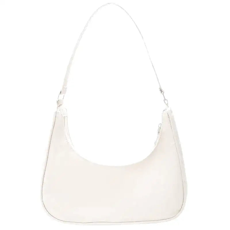 Petit sac à main MELIA en cuir souple blanc, format compact avec design chic et minimaliste, idéal pour une sortie élégante.