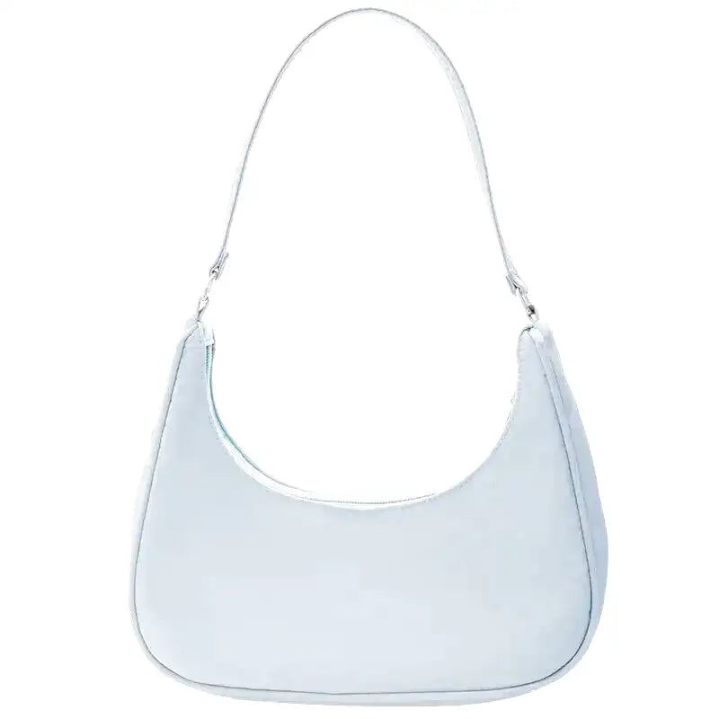 Petit sac à main MELIA en cuir souple bleu, format compact avec design chic et minimaliste, idéal pour une sortie élégante.