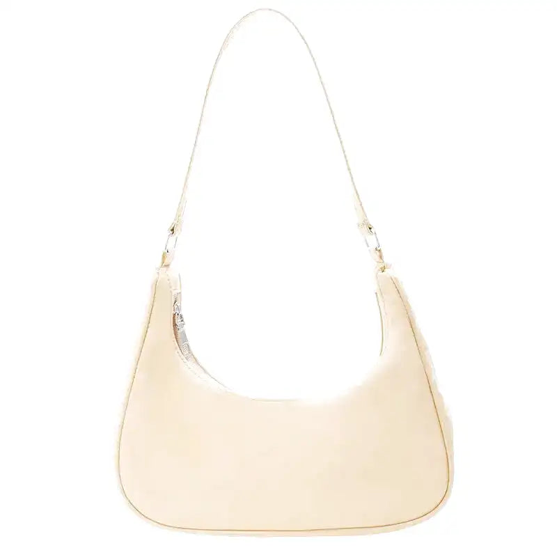 Petit sac à main MELIA en cuir souple jaune, format compact avec design chic et minimaliste, idéal pour une sortie élégante.