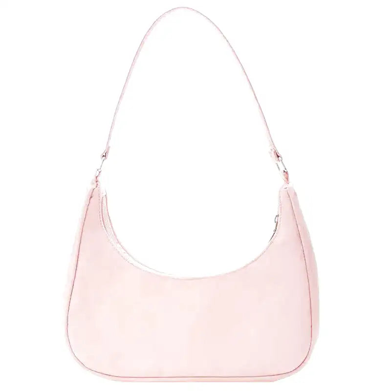 Petit sac à main MELIA en cuir souple rose, format compact avec design chic et minimaliste, idéal pour une sortie élégante.
