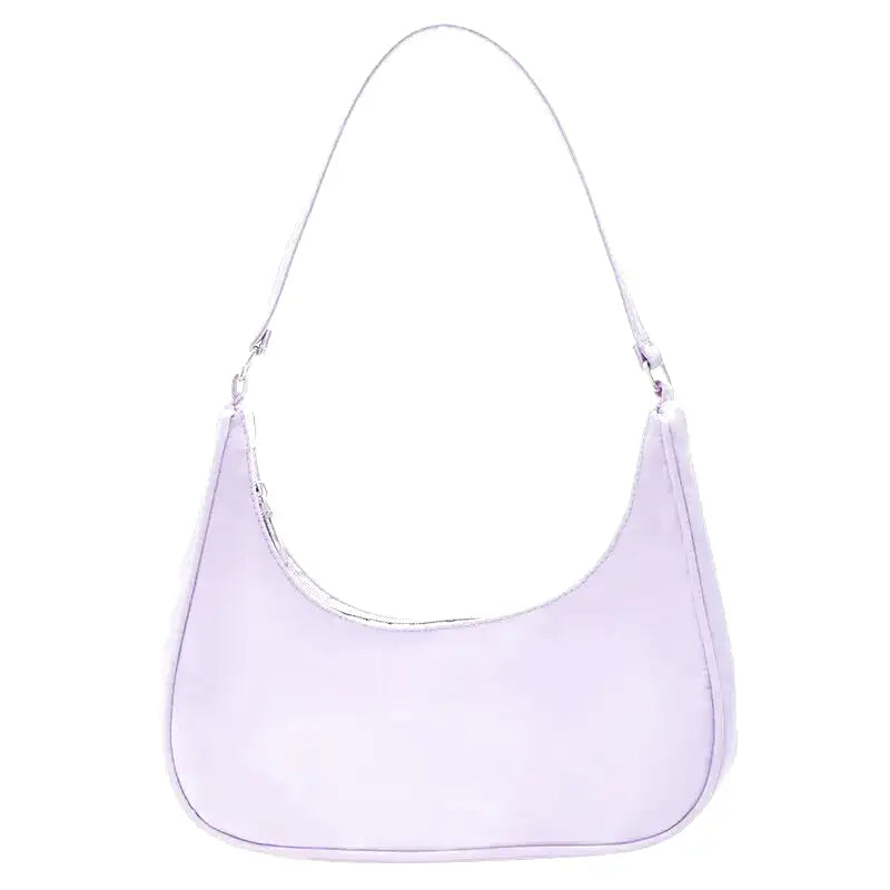 Petit sac à main MELIA en cuir souple violet, format compact avec design chic et minimaliste, idéal pour une sortie élégante.