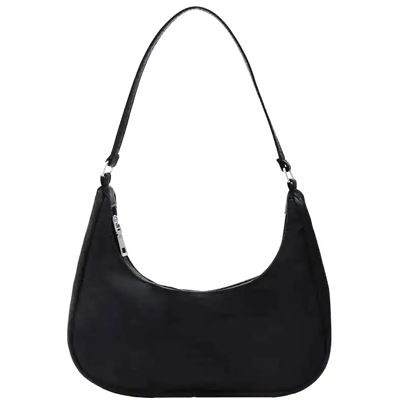Petit sac à main MELIA en cuir souple noir, format compact avec design chic et minimaliste, idéal pour une sortie élégante.