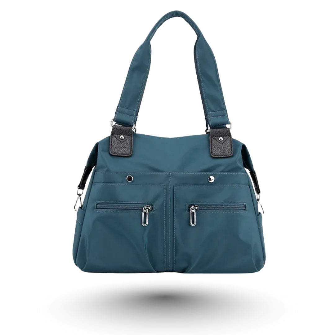 ROMY – Sac multi-poches bleu, tendance et fonctionnel, parfait pour étudiantes et professionnelles.
