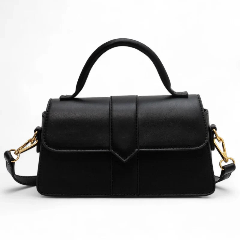 Sac à main VALENTINA petit format en cuir lisse noir, design raffiné et sobre, parfait pour transporter vos essentiels avec style
