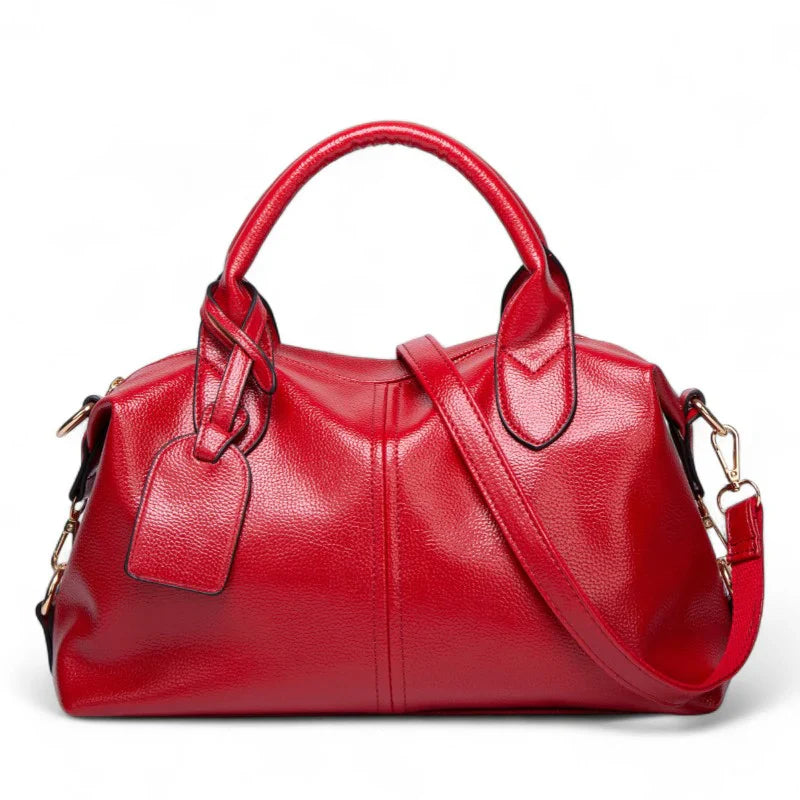 Sac à main bandoulière Yaelle en cuir rouge texturé, élégant et pratique pour étudiantes et jeunes femmes, avec bandoulière ajustable, design chic et compartiments organisés pour transporter cahiers, ordinateur et accessoires du quotidien.